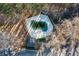 Aerial view of a covered community pool surrounded by greenery and mature trees, offering a private oasis at 6420 Magnolia Way, Morrow, GA 30260