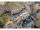 An aerial shot highlights a well-planned condo community with lush greenery, convenient parking, and mature trees at 6420 Magnolia Way, Morrow, GA 30260