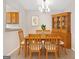 Dining area featuring table, china cabinet, and light fixture at 6420 Magnolia Way, Morrow, GA 30260