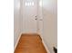 Bright hallway featuring fresh paint, modern flooring, and a clean, minimalist design at 6420 Magnolia Way, Morrow, GA 30260
