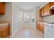 Charming breakfast nook features bright windows, updated countertops, and is bathed in natural light at 6420 Magnolia Way, Morrow, GA 30260