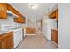 Well-equipped kitchen featuring wood cabinets, white appliances, and an open layout for cooking and entertaining at 6420 Magnolia Way, Morrow, GA 30260
