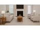 Bright living room with fireplace, neutral walls and carpet at 6420 Magnolia Way, Morrow, GA 30260