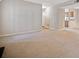 Spacious living room featuring neutral carpet and paint at 6420 Magnolia Way, Morrow, GA 30260