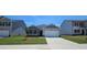 Charming single-Gathering home boasts a well-manicured lawn, a two-car garage, and a welcoming facade at 8591 Seabiscuit Rd, Lithonia, GA 30058