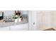Organized pantry with granite countertops, wine storage, and convenient shelving, optimizing kitchen space at 8591 Seabiscuit Rd, Lithonia, GA 30058