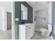 Modern bathroom featuring a white vanity, black fixtures, and a shower with stunning marble-patterned tile at 1180 Fleming St, Atlanta, GA 30080