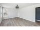 Bright bedroom featuring light gray walls, hardwood floors, ceiling fan, and a window with natural light at 1180 Fleming St, Atlanta, GA 30080
