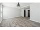 Bright bedroom featuring light gray walls, hardwood floors, ceiling fan, and windows with natural light at 1180 Fleming St, Atlanta, GA 30080