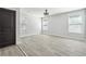 Bright bedroom featuring light gray walls, hardwood floors, ceiling fan, and windows with natural light at 1180 Fleming St, Atlanta, GA 30080