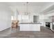 Newly installed kitchen featuring a white island, stainless steel appliances, and modern lighting at 1180 Fleming St, Atlanta, GA 30080