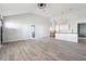 Open-concept living room with hardwood flooring and large windows allowing natural light at 1180 Fleming St, Atlanta, GA 30080