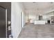 A spacious living room that leads to a kitchen with an island and stainless steel appliances at 1180 Fleming St, Atlanta, GA 30080