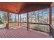 View from the porch showcasing the community, black railings and the home's stained wooden floor at 1180 Fleming St, Atlanta, GA 30080
