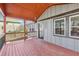 The home has a spacious outdoor porch area with stained wood flooring and black railings at 1180 Fleming St, Atlanta, GA 30080