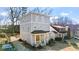 A three-story house featuring a front porch and a long driveway at 1557 Alder Se Ct, Atlanta, GA 30317