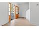 Light-filled foyer showcasing a beautiful wooden front door and pristine white walls at 1557 Alder Se Ct, Atlanta, GA 30317