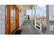 Wooden decked porch shows view of well maintained green surroundings through the wooden railings at 1557 Alder Se Ct, Atlanta, GA 30317