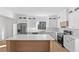 Modern kitchen features white cabinetry, stainless steel appliances, and a center island at 1557 Alder Se Ct, Atlanta, GA 30317