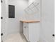 Functional laundry room with a butcher block folding counter, storage cabinet and wire shelving at 1557 Alder Se Ct, Atlanta, GA 30317