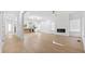 Spacious living room featuring hardwood floors, fireplace, and contemporary lighting at 1557 Alder Se Ct, Atlanta, GA 30317