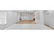 Bright and open-concept living room features modern lighting, fireplace, hardwood floors, and decorative wall art at 1557 Alder Se Ct, Atlanta, GA 30317