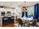 Bright kitchen featuring a dining nook, marble counters, stainless steel appliances, and wooden floors at 225 Arbor Creek Way, Roswell, GA 30076