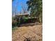 View of the backyard and elevated wood porch, showcasing the natural landscape at 3412 Sherrod Sw Dr, Marietta, GA 30060