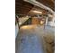 Unfinished basement featuring exposed beams and a concrete floor at 3412 Sherrod Sw Dr, Marietta, GA 30060