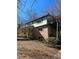 Exterior shot of the back side of a home featuring a deck at 3412 Sherrod Sw Dr, Marietta, GA 30060