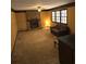 Comfortable living room featuring a brick fireplace and natural light at 3412 Sherrod Sw Dr, Marietta, GA 30060