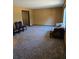 Spacious living room with neutral carpet and natural light at 3412 Sherrod Sw Dr, Marietta, GA 30060