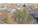 Aerial view of the property showcasing its spacious layout, proximity to the lake, and natural surroundings at 18 Village Trce, Rydal, GA 30171