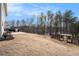 Expansive backyard with an shed, trees and a partially covered patio, perfect for outdoor activities at 18 Village Trce, Rydal, GA 30171
