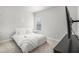 A well-lit bedroom, offering a cozy bed with a simple white color scheme at 18 Village Trce, Rydal, GA 30171