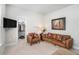 Guest bedroom with a decorative deer art piece, leather couch and two chairs at 18 Village Trce, Rydal, GA 30171