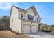 Two-story home with a two-car garage, charming facade, and lovely outdoor surroundings at 18 Village Trce, Rydal, GA 30171