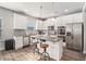 Modern kitchen with stainless steel appliances, granite countertops, and breakfast bar at 18 Village Trce, Rydal, GA 30171