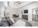 Spacious bedroom featuring a tray ceiling, sitting area, and large windows at 18 Village Trce, Rydal, GA 30171