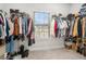 A walk-in closet provides ample storage with shelving and hanging rods at 18 Village Trce, Rydal, GA 30171