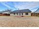 A large fenced backyard offers plenty of space for recreation and relaxation at 2506 Creek Station Dr, Buford, GA 30519
