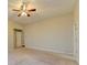 Large bedroom with neutral carpet and a ceiling fan at 2506 Creek Station Dr, Buford, GA 30519