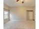 Neutral carpet, ceiling fan, and natural light in this large bedroom at 2506 Creek Station Dr, Buford, GA 30519
