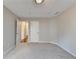 Large carpeted bedroom featuring neutral walls, natural light, and multiple entry points at 2506 Creek Station Dr, Buford, GA 30519