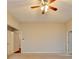 Spacious bedroom with neutral carpet and a ceiling fan at 2506 Creek Station Dr, Buford, GA 30519