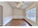 Dining room features hardwood floors, decorative trim, and a ceiling fan at 2506 Creek Station Dr, Buford, GA 30519
