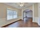 Dining room with trim detail, hardwood floors, and natural lighting at 2506 Creek Station Dr, Buford, GA 30519