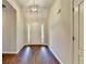 A welcoming foyer featuring gleaming hardwood floors and a stylish pendant light, creating an inviting entrance at 2506 Creek Station Dr, Buford, GA 30519