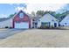 A well-maintained single-Gathering home features a mix of brick and siding, a two-car garage, and established landscaping at 2506 Creek Station Dr, Buford, GA 30519