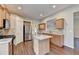 Modern kitchen showcasing stainless appliances, granite counters, and a central island at 2506 Creek Station Dr, Buford, GA 30519